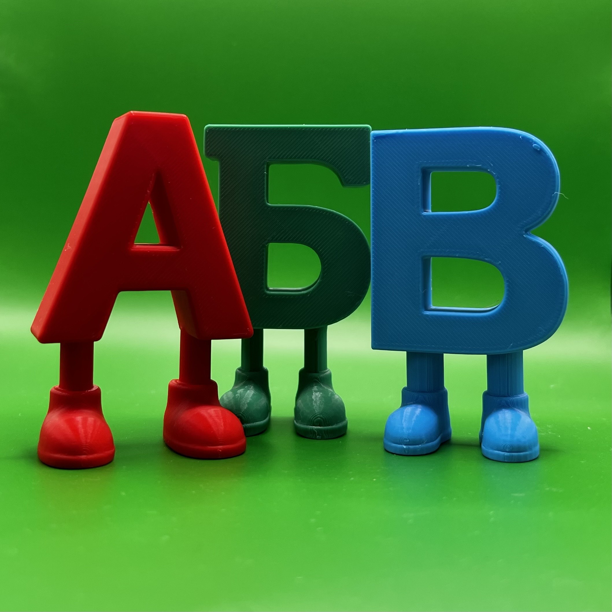 Bulgarian Cyrillic letters А Б В with legs - red, dark green and blue