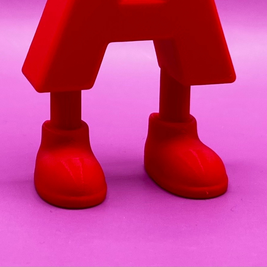 Close-up of printed letter feet showing built-in stability