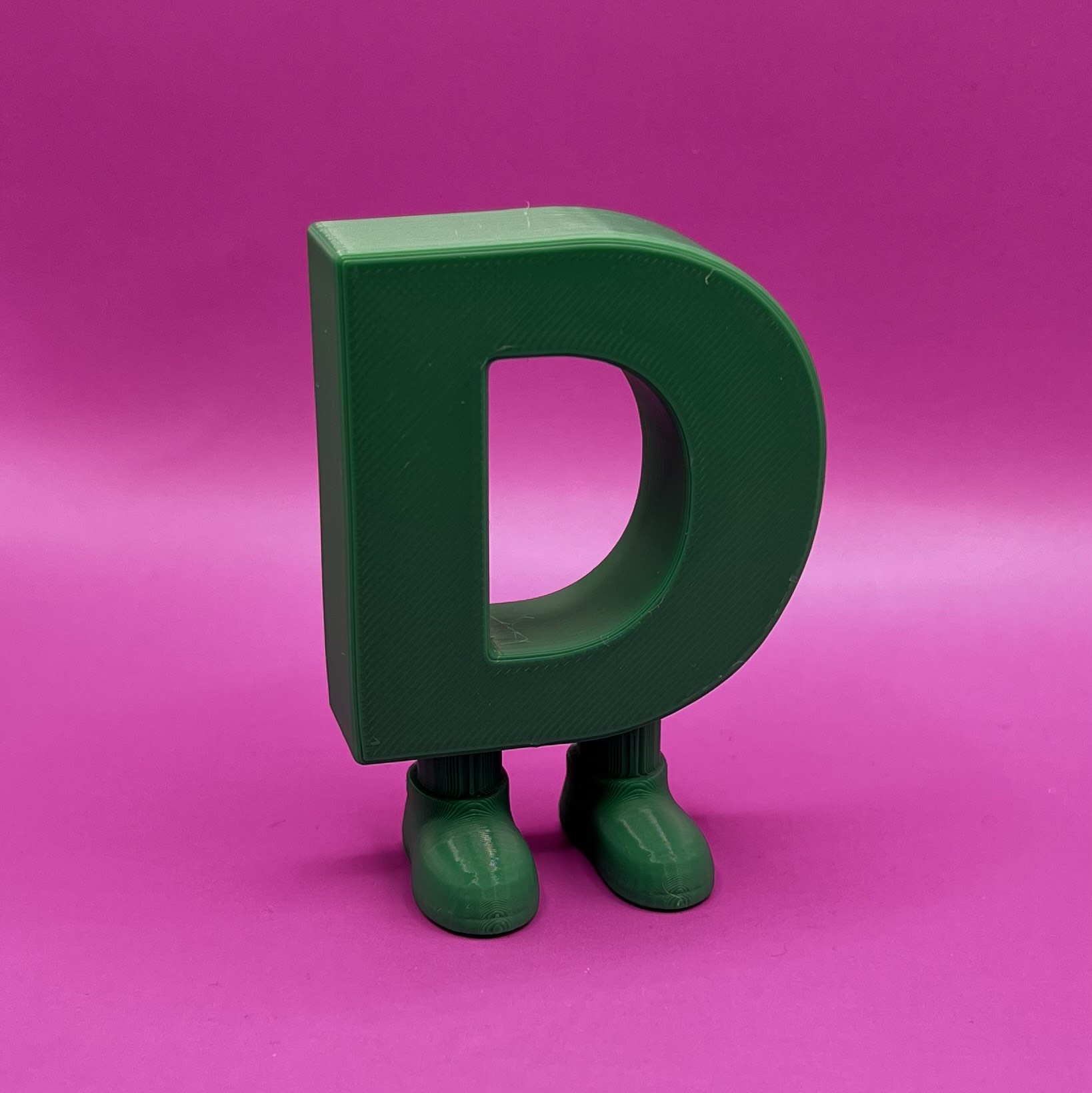 Letter D with legs
