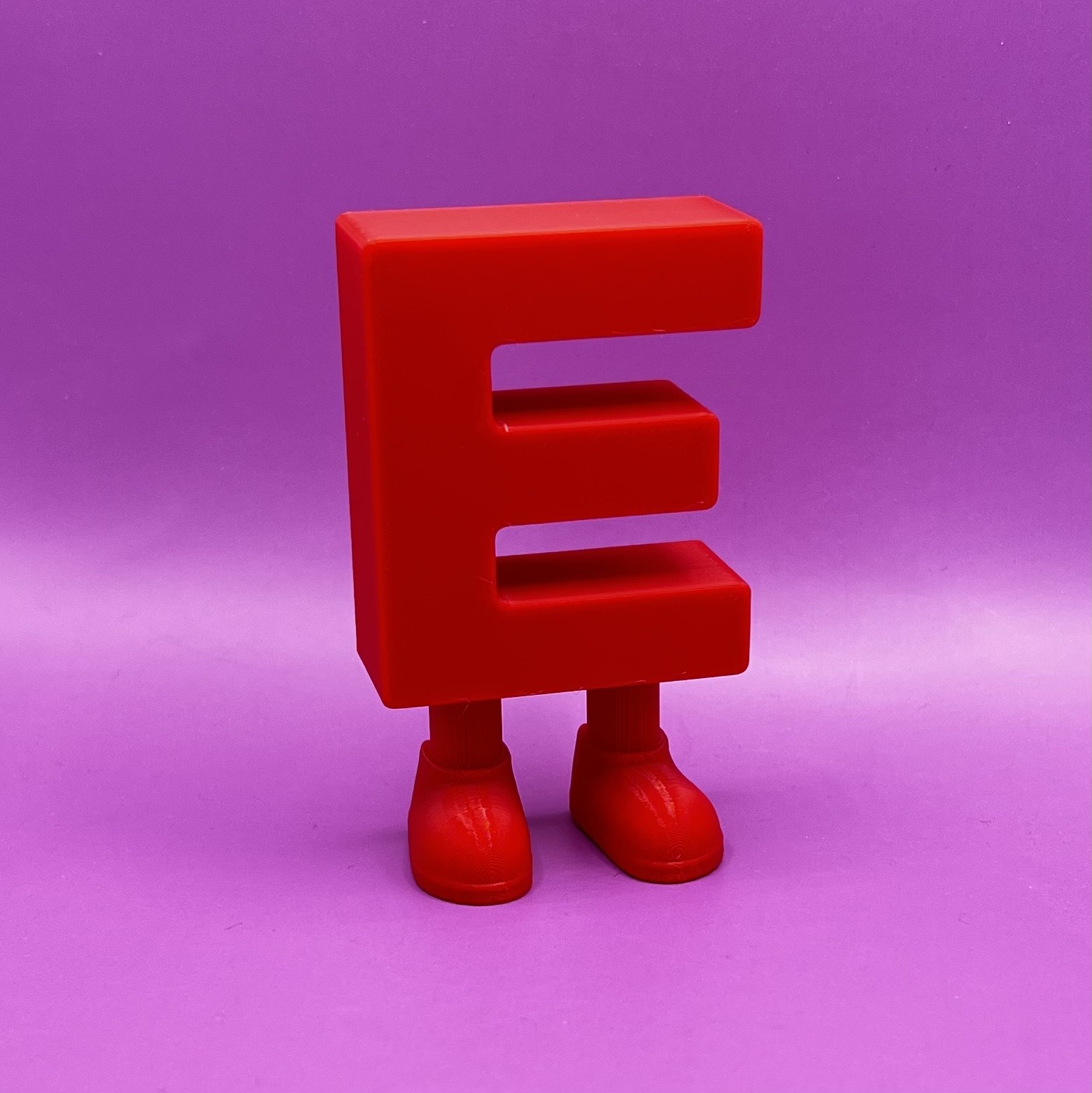 Letter E with legs