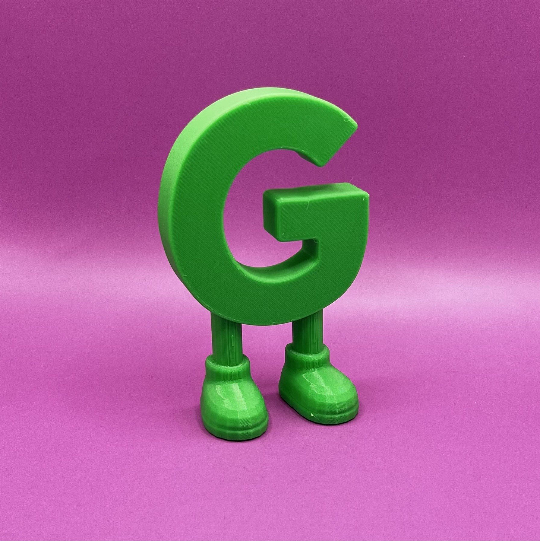 Letter G with legs