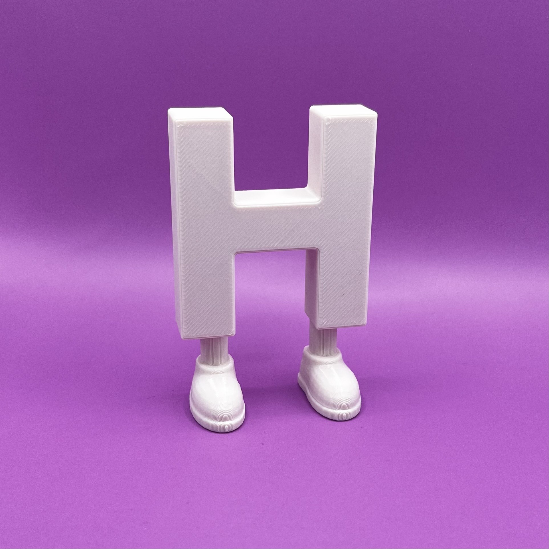 Letter H with legs