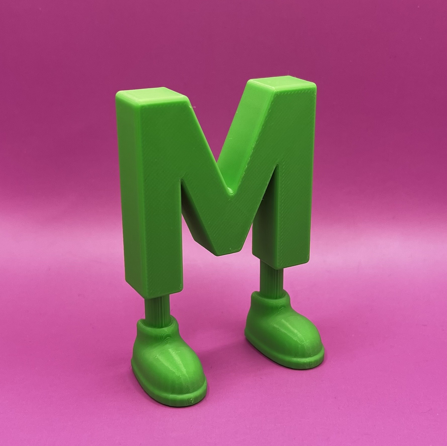 Letter M with legs