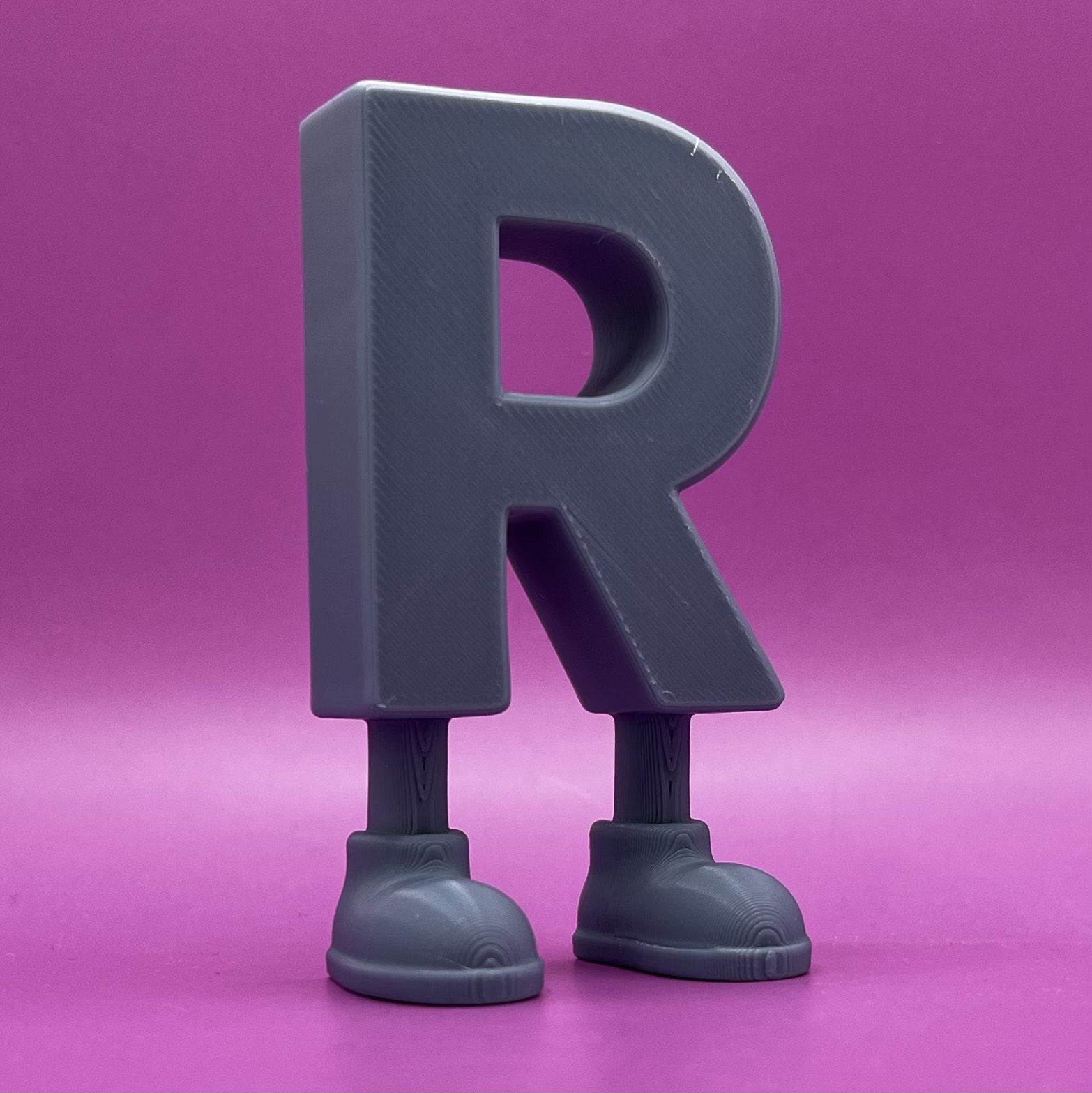 Letter R with legs
